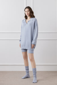Model in a Wunder Silk-Wool-Cashmere Short Tracksuit in a serene sky blue color.