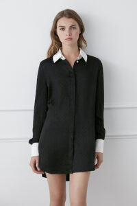Model in a sophisticated Monogram Silk Long Shirt in white featuring a subtle quilted pattern.