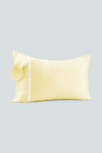 Macaron Silk Pillowcase & Eye Mask Set in a soft yellow hue featuring matching silk pillowcase and eye mask.