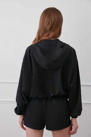 Back view of black Athflow women's sun protection hoodie set with hood.