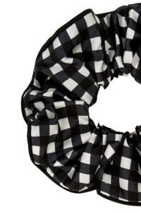 Detail shot of the black gingham silk scrunchie from the Blooming Gift Box.