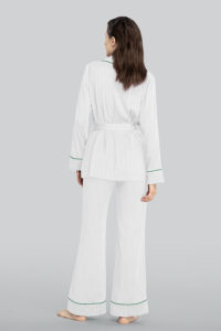 A woman seen from the back, wearing MANITO Embossed striped pajama set in white.