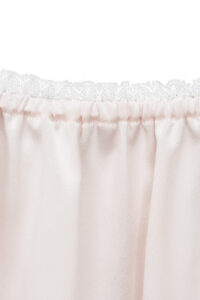 Close-up of neckline lace trim on MANITO Fairy Kid's Tank Nightdress in light pink silk.