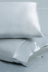 The 22 two-piece silk pillowcase set in elegant soft blue color.