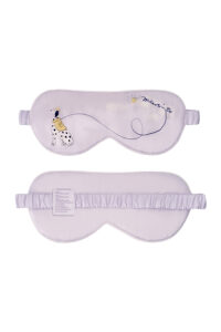 Puppy Silk Eyemask in purple with a spotted dog illustration and a leash forming a looping logo motif, shown front and back.