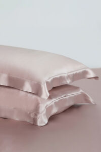 Two-piece 22 silk pillow sham set in soft pink, showcasing elegance and luxury for restful sleep.
