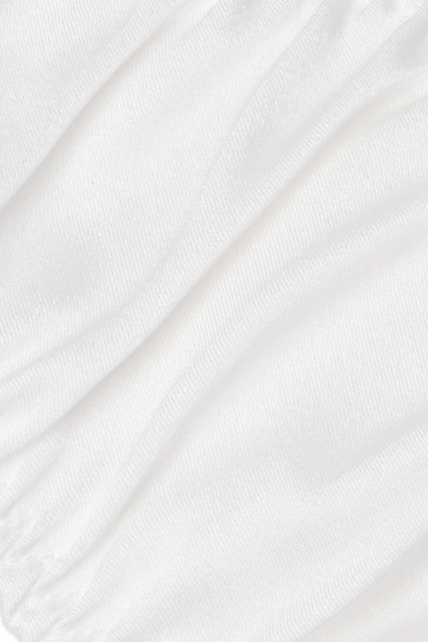 Close-up of Tacetto silk brief in white, highlighting the smooth, lustrous texture and refined stitching details.