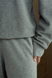 Close-up of gray Terra Knit Set, showing the fine-textured weave and smooth cashmere-silk blend fabric.